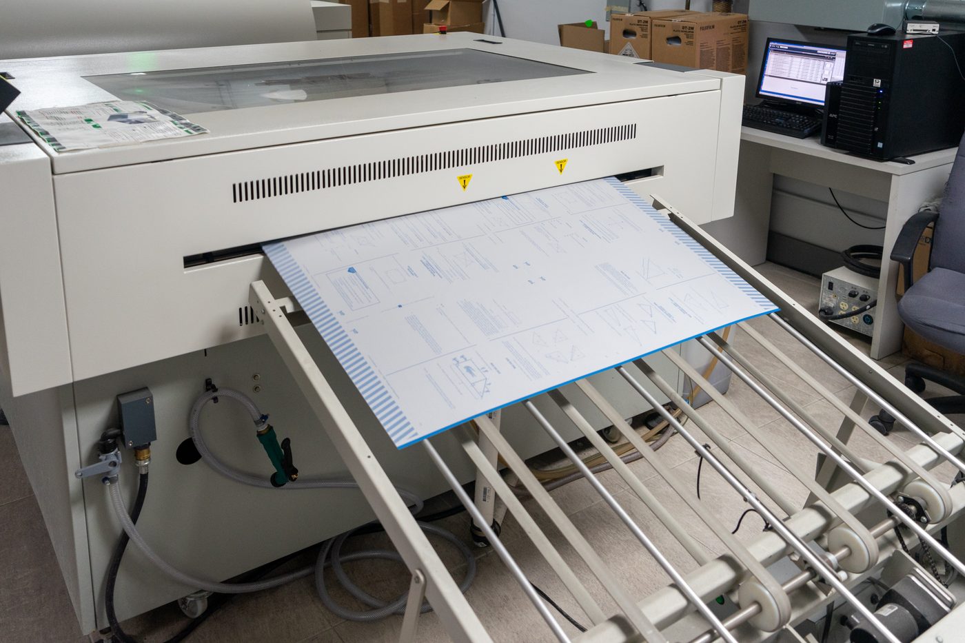Solo Printing operators at the computer-to-plate prepress station in Miami